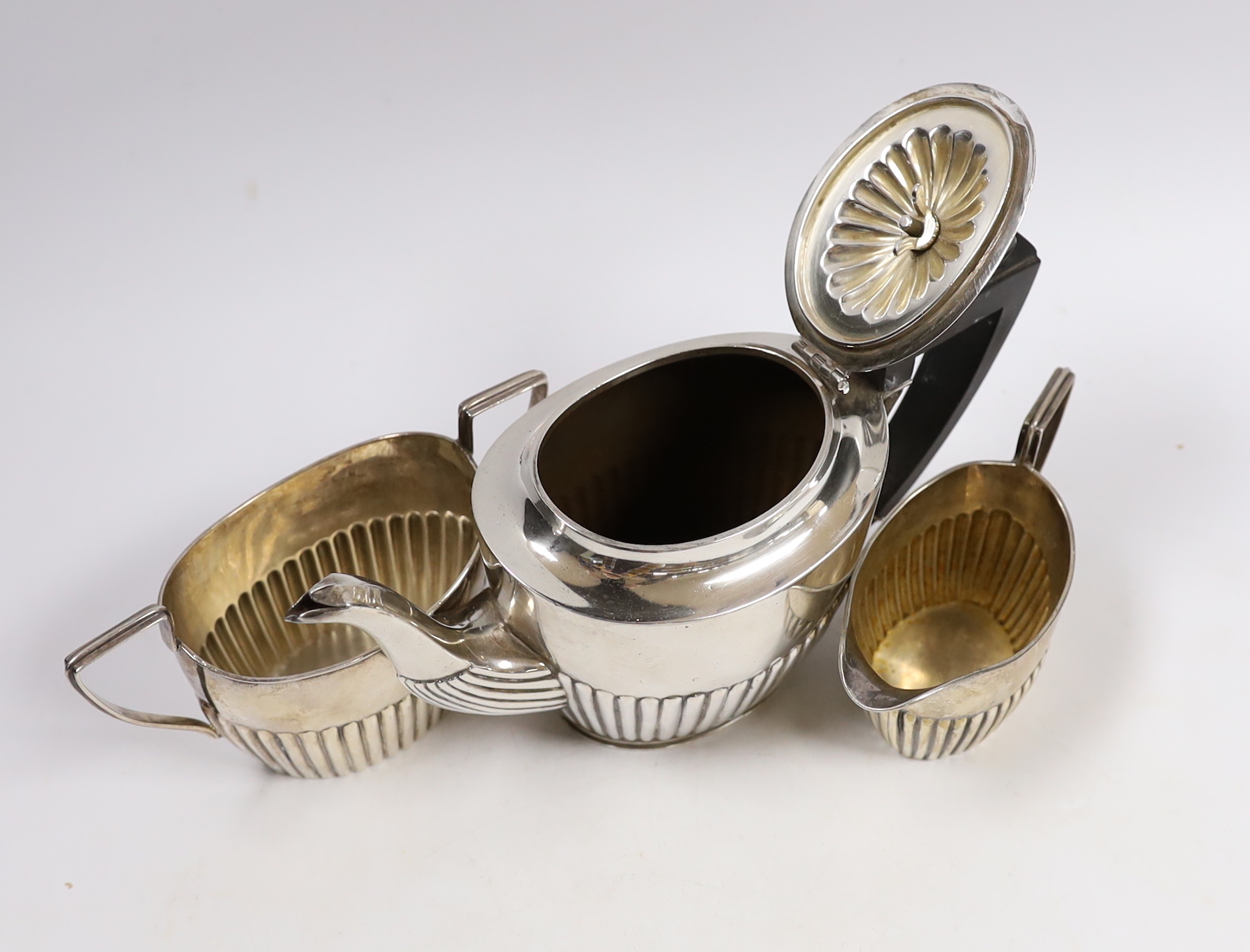 A matched late Victorian demi fluted three piece tea set, gross weight 16oz.